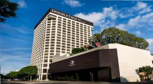 a building with a sign on the top of it at Doubletree by Hilton Los Angeles Downtown in Los Angeles