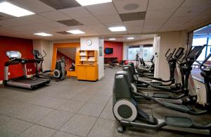 a gym with a row of treadmills and ellipticals at Doubletree by Hilton Los Angeles Downtown in Los Angeles
