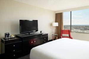 a hotel room with a bed and a flat screen tv at Doubletree by Hilton Los Angeles Downtown in Los Angeles