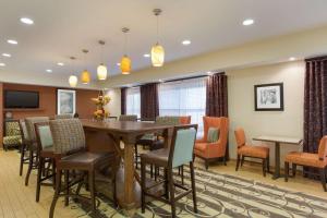 a dining room with a table and chairs at Hampton Inn Lubbock in Lubbock