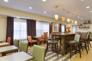 a dining room with a table and chairs at Hampton Inn Lubbock in Lubbock