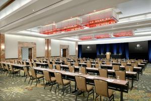 a large room with rows of tables and chairs at Doubletree by Hilton Los Angeles Downtown in Los Angeles