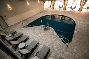 an overhead view of a swimming pool in a building at Doubletree By Hilton Lubbock - University Area in Lubbock