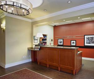 a waiting room with a counter in a hospital at Hampton Inn West Palm Beach Central Airport in West Palm Beach +48 photos