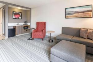 a living room with a couch and a chair at Hilton Garden Inn Reno in Reno
