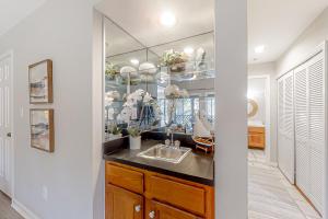 a kitchen with a sink and a mirror at Turtle Cove 5546 in Kiawah Island