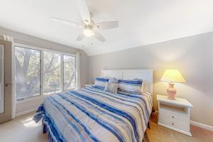 a bedroom with a bed and a ceiling fan at Turtle Cove 5546 in Kiawah Island