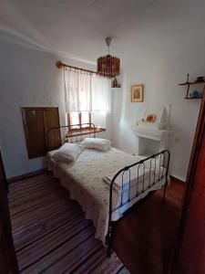 Postel nebo postele na pokoji v ubytování Archontiko Maros
