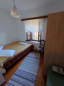 Postel nebo postele na pokoji v ubytování Archontiko Maros
