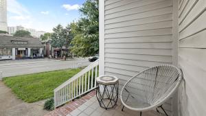 a white porch with a bench and a street at Classic 1 Bedroom Apt in Midtown, ATL in Atlanta