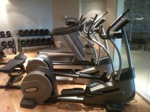 a gym with a treadmill and other cardio equipment at Havsdalsgrenda Geilo Apartments in Geilo