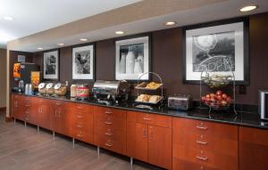 a kitchen with a counter with food on it at Hampton Inn St. Joseph in Saint Joseph