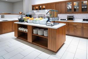 a kitchen with a counter with plates on it at Homewood Suites by Hilton Salt Lake City Downtown in Salt Lake City