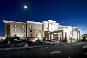 a hotel with cars parked in a parking lot at Hampton Inn Statesville in Statesville