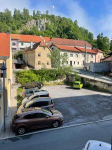 a group of cars parked in a parking lot at Newly adapted 3-room apartment in Postojna