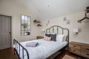 a bedroom with a bed with two pillows on it at Paradise Square-Remodelled 18th Century Apartment in Sheffield