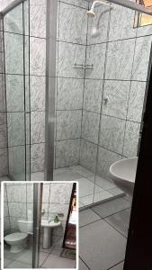 y baño con ducha, aseo y lavamanos. en CASA DE PRAIA CAJUEIRO ALTER, en Alter do Chao