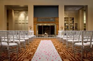 a room with rows of chairs and a aisle with a altar at DoubleTree Boston North Shore Danvers in Danvers