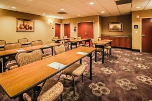 a conference room with wooden tables and chairs at Hampton Inn & Suites Tomball in Tomball