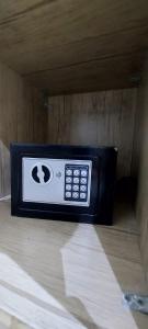 a black and white microwave sitting on the floor at سما رفحاء للشقق المخدومة in Rafha