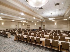 a large room with rows of tables and chairs at Hilton Garden Inn Cleveland/Twinsburg in Twinsburg