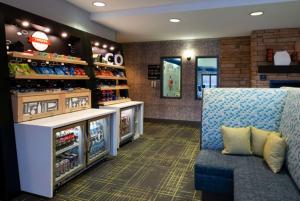 a waiting room with a couch and a store at Hampton Inn Glenwood Springs in Glenwood Springs