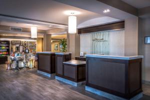 a lobby of a store with counters and a pharmacy at Hilton Garden Inn Reagan National Airport in Arlington