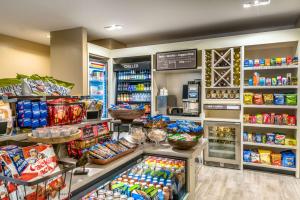 a store filled with lots of food and drinks at Hilton Garden Inn Reagan National Airport in Arlington