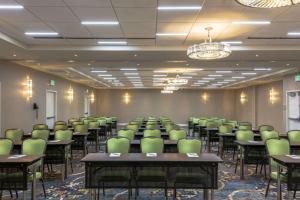 a conference room with tables and chairs in it at Hilton Garden Inn Reagan National Airport in Arlington