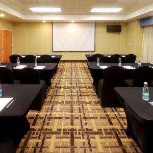 a conference room with tables and a projection screen at Hampton by Hilton Reynosa Zona Industrial in Reynosa +16 photos