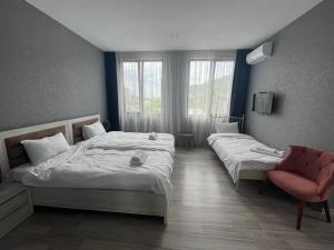 Voodi või voodid majutusasutuse Hotel FLEUR DE LIS toas
