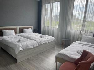 Voodi või voodid majutusasutuse Hotel FLEUR DE LIS toas