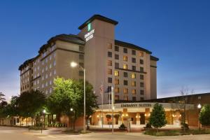 a hotel with a sign on top of a building at Embassy Suites Lincoln in Lincoln