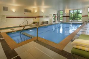 a large swimming pool in a building at DoubleTree by Hilton Dulles Airport-Sterling in Sterling