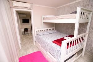 מיטה או מיטות קומותיים בחדר ב-ASP hospedaria