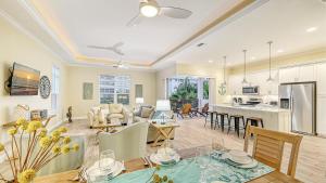 a living room with a dining room and a kitchen at Casa Antilles - 1036L in Siesta Key