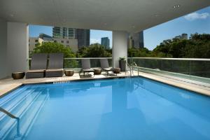 a swimming pool on the roof of a building at Homewood Suites by Hilton Miami Downtown/Brickell in Miami