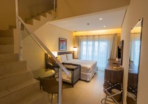 Uma área de estar em Amora Hotel Maresias