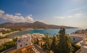a view of a town with a beach and buildings at St.George Valsamitis in Katapola