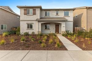 a house with a sidewalk in front of it at Only available on other site in Sacramento