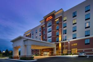 a hotel with a sign on the front of it at Hampton Inn and Suites Washington DC North/Gaithersburg in Gaithersburg