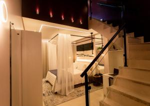 Cama ou camas em um quarto em Amora Hotel Maresias