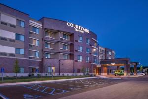 a building with a parking lot in front of it at Courtyard by Marriott St Louis Chesterfield in Chesterfield