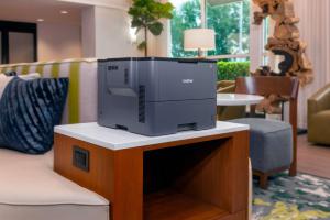 a television sitting on a stand in a living room at Hampton Inn and Suites Sarasota/Lakewood Ranch in Sarasota