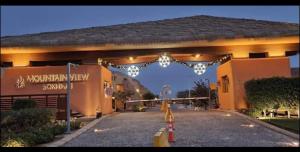 an entrance to a building with an arch with lights at Mountain View 1 /Ain El Sokhna in Ain Sokhna