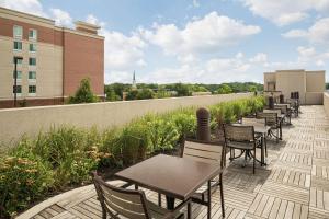 a row of tables and chairs on a patio at Homewood Suites Springfield in Springfield