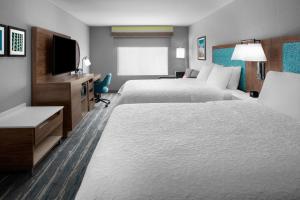 Rúm í herbergi á Hampton Inn Phoenix - Biltmore