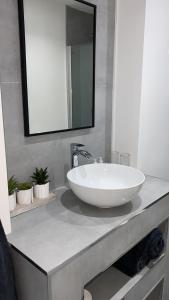 a bathroom with a large white sink on a counter at Newpark in Cobh