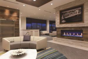 a living room with a fireplace and a couch at Homewood Suites by Hilton Pittsburgh Downtown in Pittsburgh