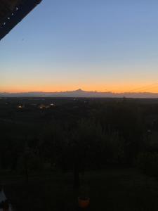 a sunset seen from the balcony of a house at Antica Cascina Pilo in Monchiero